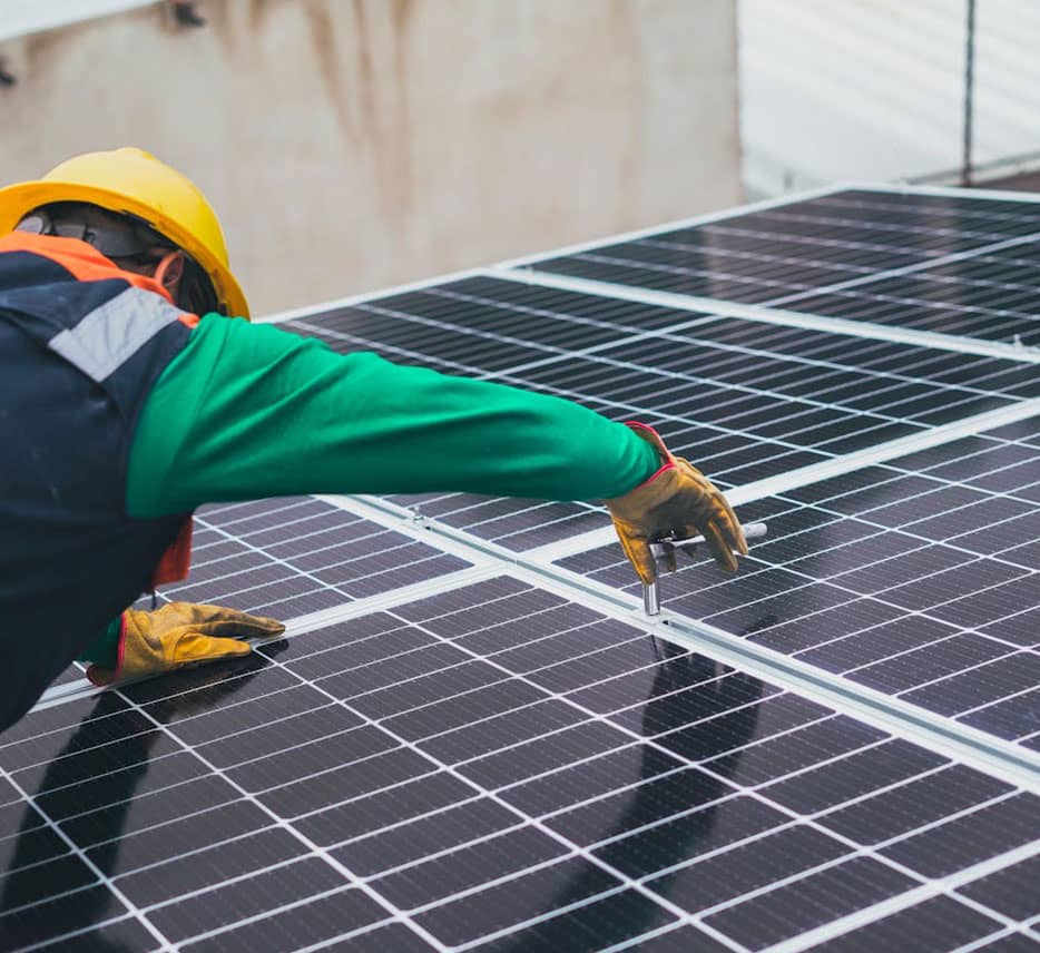 man installing solar panel